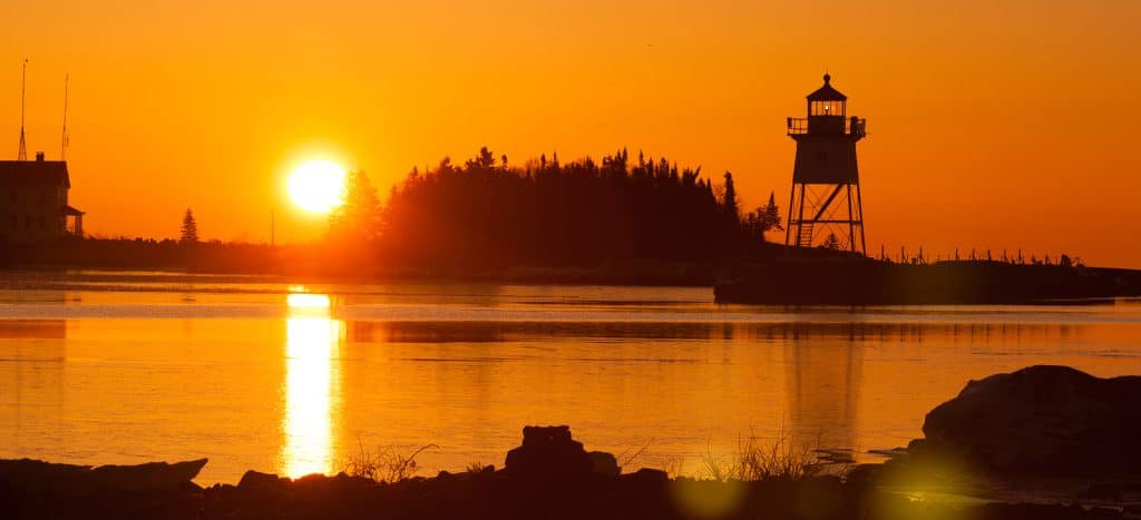 The sun floods orange after passing the horizon